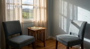 Two empty chairs facing each other in a sunlit consultation room, symbolizing a respectful therapeutic relationship and the space for honest conversation between patient and psychiatrist