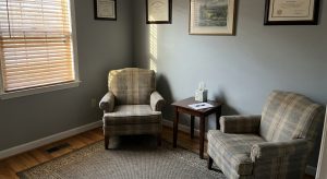 Two chairs in a quiet psychiatry consultation room with natural light, representing a safe space for mental health care in Danville, VA